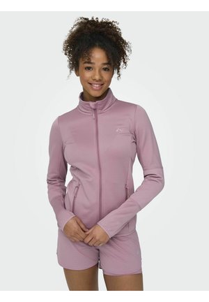 Helles rosa Sportjacke mit Stehkragen, vorderem Reißverschluss und Seitentaschen. Der Stoff erscheint glatt mit dezenten Texturdetails.