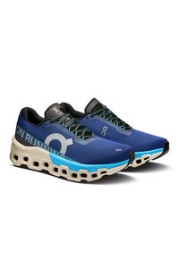 Blue running shoes with a textured upper, contrasting light blue sole, and hexagonal cushioning. Features black laces and reflective accents.