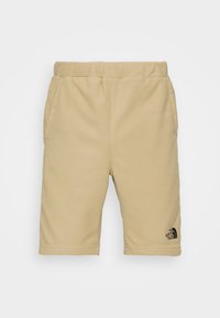 Beiga fleece-shorts med elastisk midja och sidofickor, med The North Face-logotyp på nedre vänstra benet.