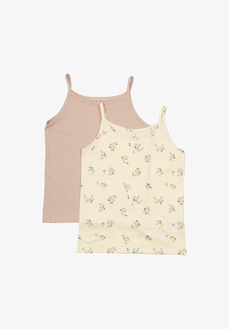 Two sleeveless tops: one in plain light brown fabric, the other in cream with a floral pattern in pastel colors. Both have thin straps.