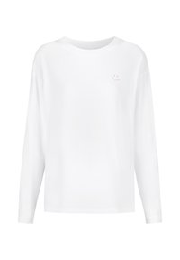 Wit shirt met lange mouwen gemaakt van katoen. Voorzien van een kleine roze smiley-print op de linkerborst. Eenvoudige, ontspannen pasvorm.