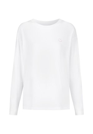 Wit shirt met lange mouwen gemaakt van katoen. Voorzien van een kleine roze smiley-print op de linkerborst. Eenvoudige, ontspannen pasvorm.