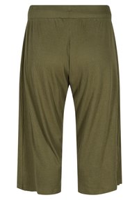 Olivgröna knälånga shorts i ribbat tyg med elastisk midja. Har en lös och luftig passform. Inga fickor eller dekorationer.