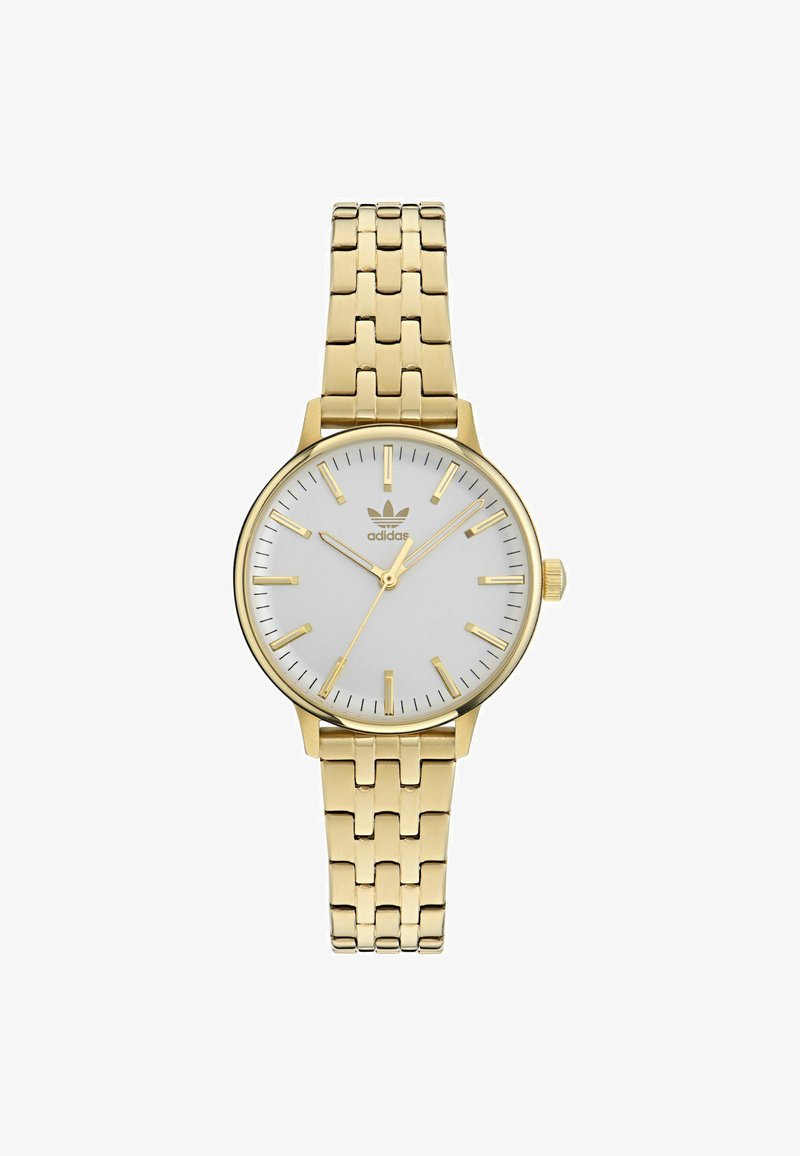 Guldtonad armbandsur med en slät vit urtavla, smala guld timmarkörer, tre visare och ett armband av guldfärgad metallkedja. Logotypen för varumärket på urtavlan.