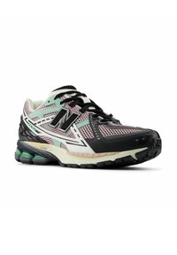 Men's athletic shoe featuring a multicolored mesh upper in pink, mint, and black, with thick black sole and prominent "N" logo on the side.