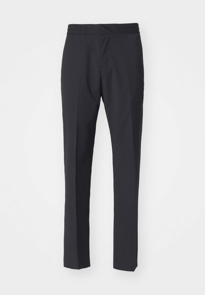 Dark navy elastic waistband trousers with a tapered design, featuring a smooth texture and two front pockets. No visible patterns or hardware.