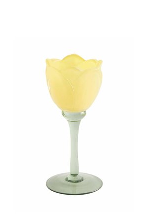 Yellow tulip-shaped candle holder with a translucent green glass stem and round base on a white background.