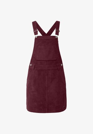 Burgundijas krāsas korduroja kopējais kleita ar krustiskām regulējamām siksnām, priekšējo kabatu un sudraba aparatūras akcentiem; teksturēts un ceļgala garuma dizains.