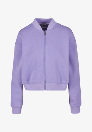 Lilla bumbleriiet valgest pehmest kangast, millel on ees lukk, ribikrae ja mansetid. Lühendatud disain ja mugav lõige.