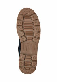 Semelle de chaussure en caoutchouc avec un motif texturé brun, présentant des creux profonds et une marque. Taille 37 indiquée sur le côté.
