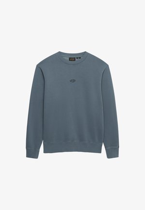 Niebieska bluza z długim rękawem i okrągłym dekoltem, z prążkowanymi mankietami i ściągaczem u dołu, z małym logo "Superdry" umieszczonym na środku klatki piersiowej.