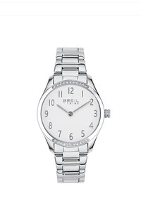 Montre en métal argenté avec un cadran blanc, des index numériques, des accents en cristal et un bracelet poli. Elle possède un boîtier rond et une couronne.