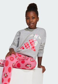 Gray sweatshirt with a Minnie Mouse graphic and red polka dot accents, paired with pink leggings featuring polka dots and character prints.