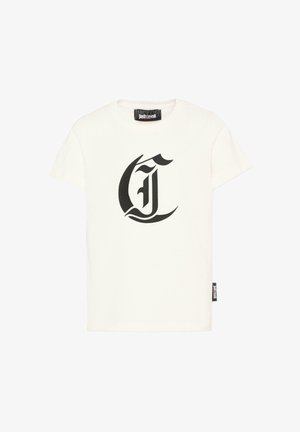 T-shirt blanc à manches courtes avec une grande lettre gothique noire "J" imprimée sur le devant et une étiquette Just Cavalli au niveau de l'encolure et de l'ourlet latéral.