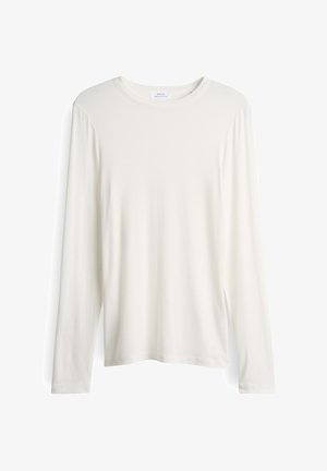 Langarmshirt van zachte, roomkleurige stof. Ronde hals met rechte snit. Bevat een label op de achterkant van de hals.