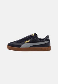 Navy blue Puma sneaker with grey side stripe, gum rubber sole, gold Puma logo, and black laces on a white background.
