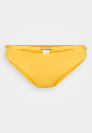 Parte inferiore di bikini gialla realizzata in tessuto liscia. Presenta un design senza cuciture e un accento metallico sul retro, offrendo uno stile minimalista.