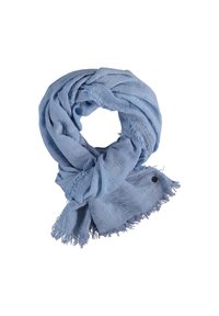 Hellblauer Schal aus weichem, strukturiertem Material mit ausgefransten Kanten und einem schwarzen dekorativen Akzent. Kreisförmige Anordnung zeigt seine Form.