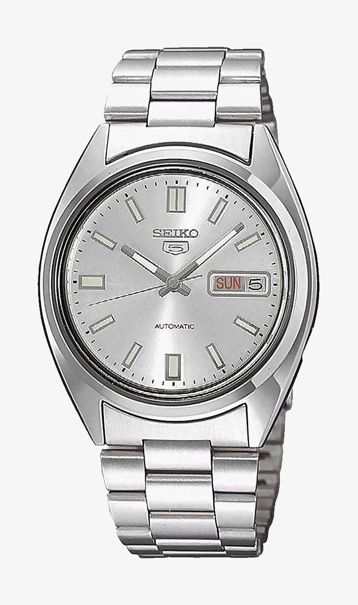Silver automatic watch with a stainless steel band, circular dial, hour markers, and date display; features Seiko branding.
