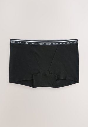Black stretchy boxer briefs with branded elastic waistband labeled "NEXT" on a light background.