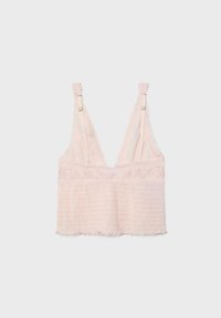 Light pink lace bralette with adjustable straps, deep V-neck, and textured fabric on the front.