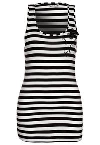 Black and white striped tank top with a scoop neckline; features a decorative floral accent on the left side near the shoulder.