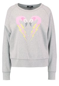 Sweat-shirt gris clair avec deux têtes de flamants roses se faisant face et des éclairs jaunes formant un cœur à l'avant.