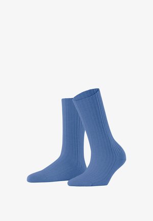 Calzini blu a coste con una morbida texture, caratterizzati da un design a metà polpaccio e una punta rinforzata. Progettati per comfort e durata.