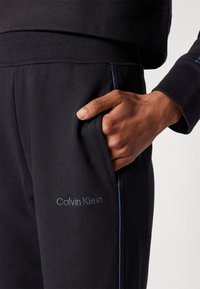 Calvin Klein Underwear FRENCH TERRY LOGOPANTS - Spodnji del pižame - black
