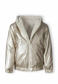 Metāliska zelta zip-up jaka ar kažokādas odere uz kapuces. Iezīmē elastīgus piedurkņu un apakšmalas galus, kā arī fakturētu ārējo virsmu. Iekšpusē tā ir mīksta un siltā.