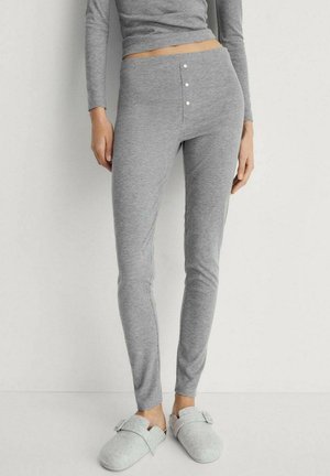 Gray leggings made from soft fabric, featuring a fitted design, three-button accent at the waist, and a smooth texture.