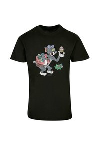 Black cotton t-shirt featuring a cartoon character holding a decorated Easter egg, with a basket of colorful eggs and a small plant illustration.