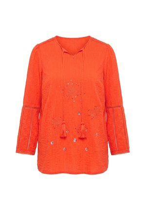 Fel oranje blouse met lange mouwen en kwastjes aan de V-hals, gestructureerde stof, kanten inzetten op de mouwen en bloemenborduursel met pailletten op de voorkant.