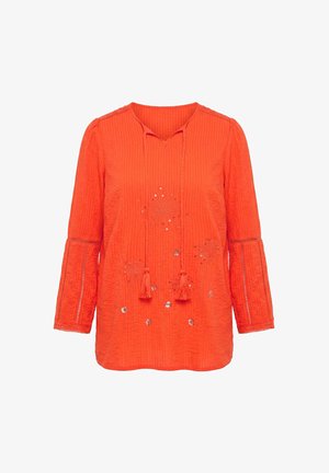 Fel oranje blouse met lange mouwen en kwastjes aan de V-hals, gestructureerde stof, kanten inzetten op de mouwen en bloemenborduursel met pailletten op de voorkant.
