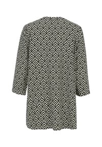 Long-sleeve black and white patterned shirt with leaf-like geometric design, shown from the back.