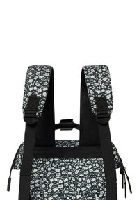 Floral patterned backpack with black straps. Features a colorful design of small flowers on a dark background, adjustable straps, and durable material.