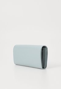 Light blue leather wallet, rectangular shape, textured surface, with a fold-over design and open interior compartments.
