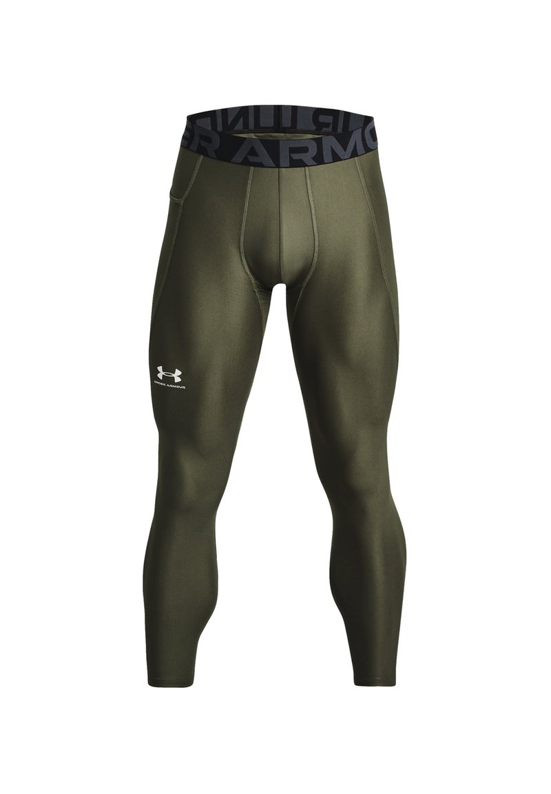 Olijfgroene compressieleggings met een zwarte elastische tailleband met het "UNDER ARMOUR" logo. Glad textuur en aansluitend ontwerp.