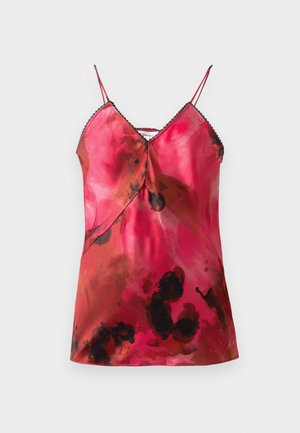 Top en satin à fines bretelles, présentant un décolleté en V profond et un motif aquarelle rose et marron avec des accents noirs le long du col.