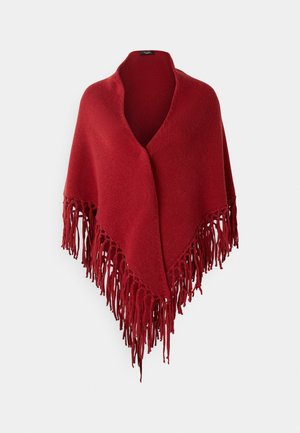 Rød strikket poncho med V-udskæring og lange frynser, der har en blød tekstur og en jævn farve hele vejen igennem.