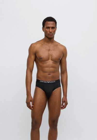 Zwarte herenonderbroeken met een elastische tailleband met het "Emporio Armani"-logo. Gladde stof, aansluitend ontwerp, zonder extra patronen of accenten.