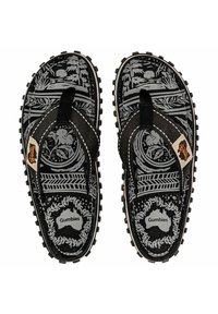 Black flip-flops with a patterned grey footbed featuring trees and sun, textured black straps, and embossed logo on the insole.