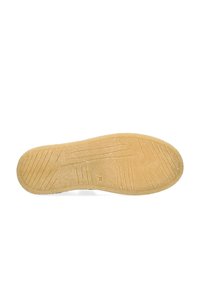 Rubber shoe sole, textured with horizontal and vertical grooves, featuring a light beige color and a slightly raised edge for grip.