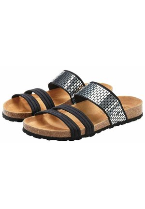 Sandales noires avec deux sangles élastiques et un accent métallique tissé. Semelle en liège et semelle en caoutchouc texturé pour le confort et l'adhérence.