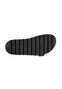 Suola di scarpa in gomma nera con scanalature orizzontali, punta arrotondata e finitura liscia. Presenta un leggero tacco e una texture rigata per una maggiore aderenza.