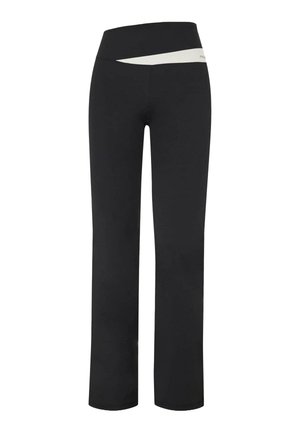 Pantalons de yoga noirs taille haute avec un détail de bande angulaire blanche sur la taille, présentant une silhouette ajustée et des jambes droites.