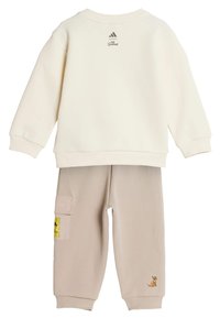 White sweatshirt and beige joggers set. Sweatshirt has ribbed cuffs and neckline, joggers feature side pocket and small dog embroidery.