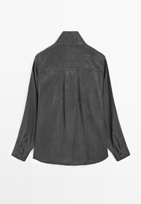 Gray suede shirt with a collared neckline, long sleeves, and button cuffs. Features a pleat detail at the back for a relaxed fit.