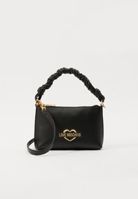 Black leather handbag with a twisted handle, gold hardware, and a heart logo. Features a zip closure and an adjustable shoulder strap.
