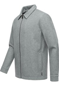 Veste en feutre gris avec col, fermeture éclair intégrale, deux poches latérales, et poignets côtelés. Design simple avec une texture lisse.